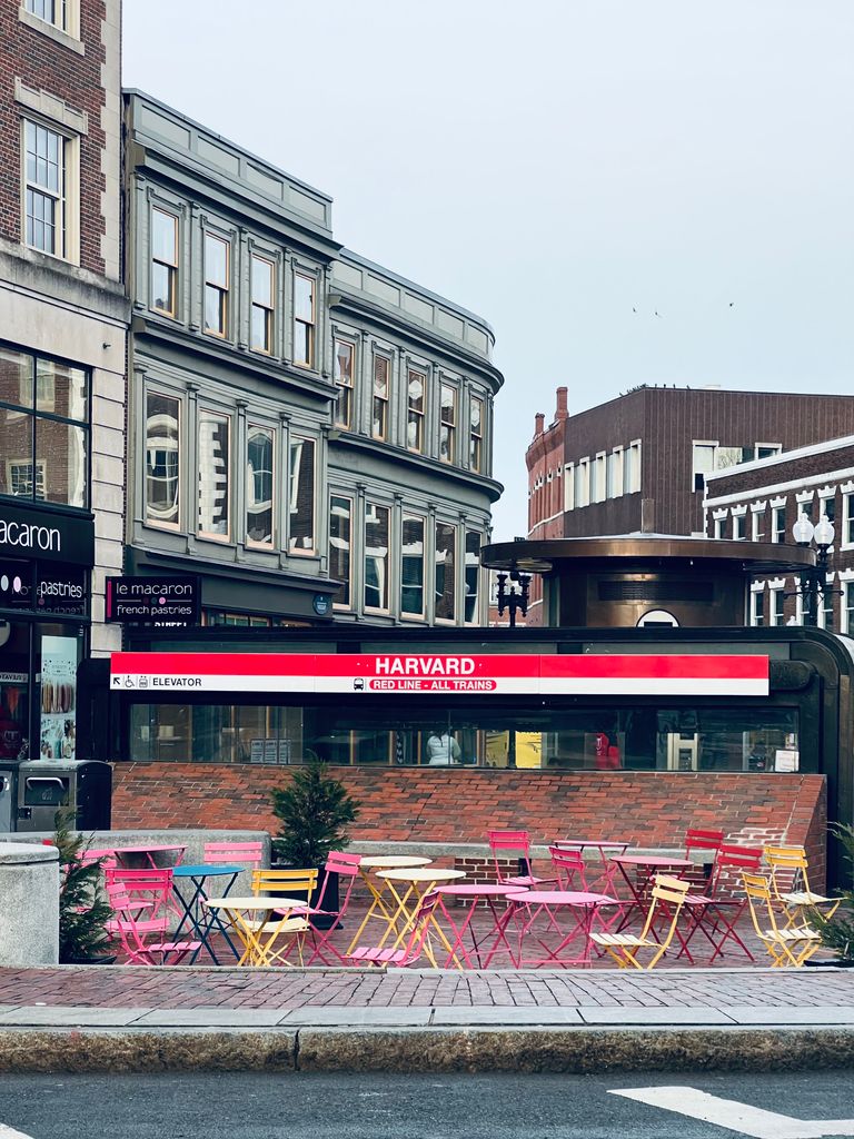 Harvard Square subway entrance and vibrant seating in Cambridge, Massachusetts.